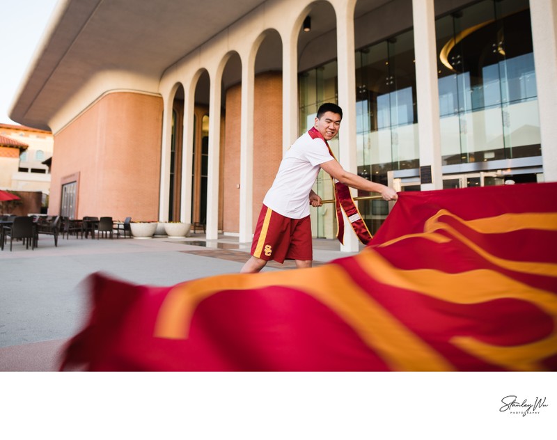 Trojan Spirit Leader Graduation Photo Waving USC Flag Trojan Spirit Leader Graduation Photo Waving USC Flag
